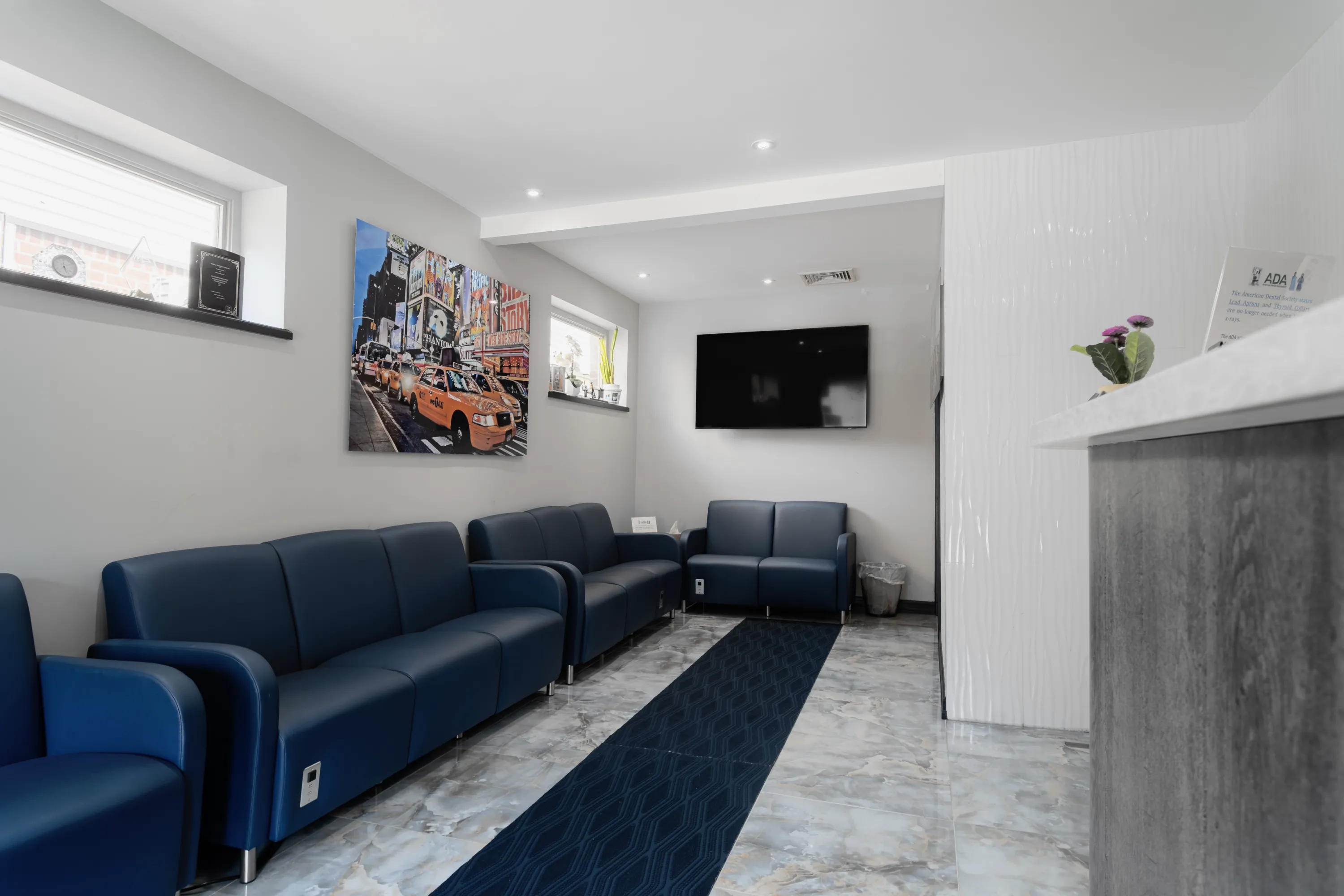 Modern reception and waiting area at Queensboro Oral Surgery in Fresh Meadows, NY