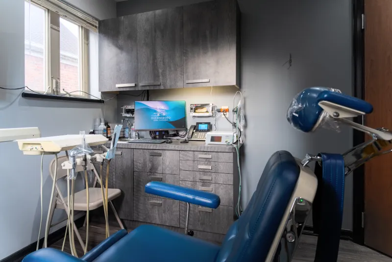 Treatment room with dental chair at Queensboro Oral Surgery for tooth extractions